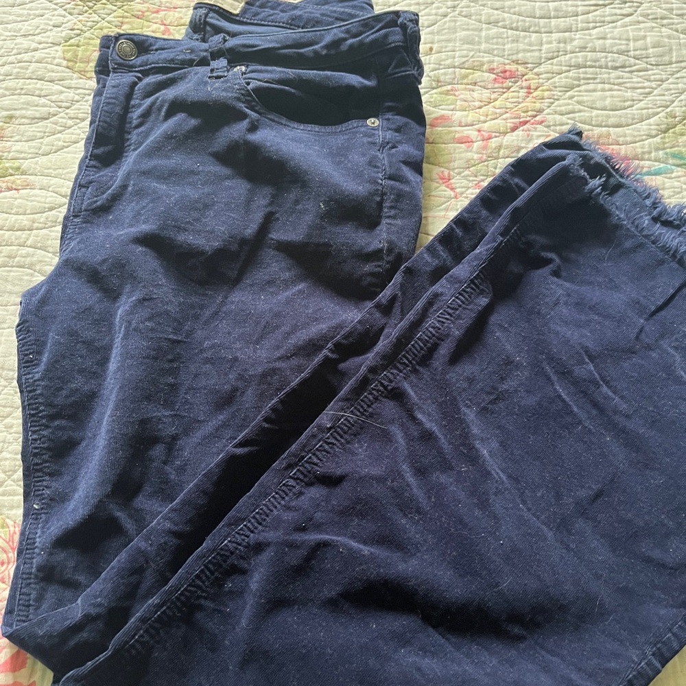 Navy corduroy pants with a unfinished ham and a flare